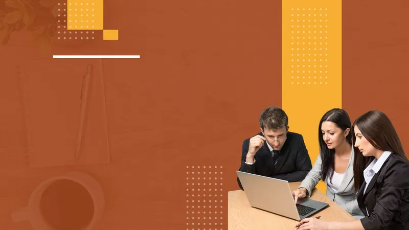 A group of people are sitting at a table looking at a laptop computer.