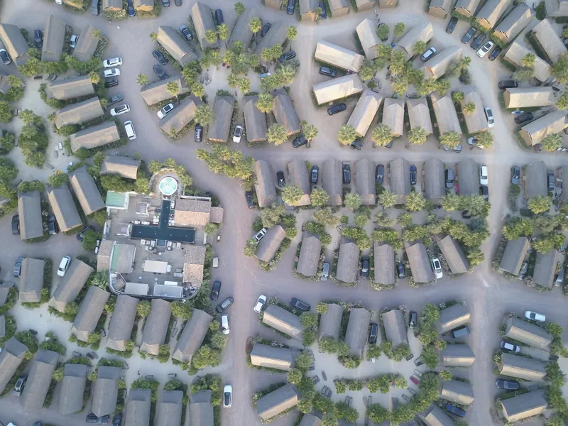 An aerial view of a residential area with lots of houses and trees